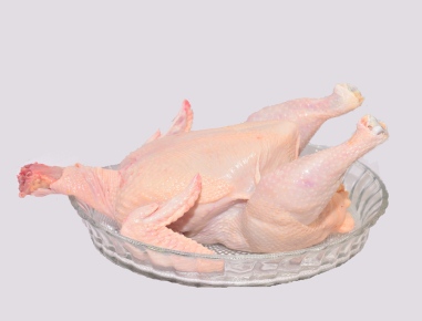 The chicken is boiled in hot water and de feathered in feather out machine. 